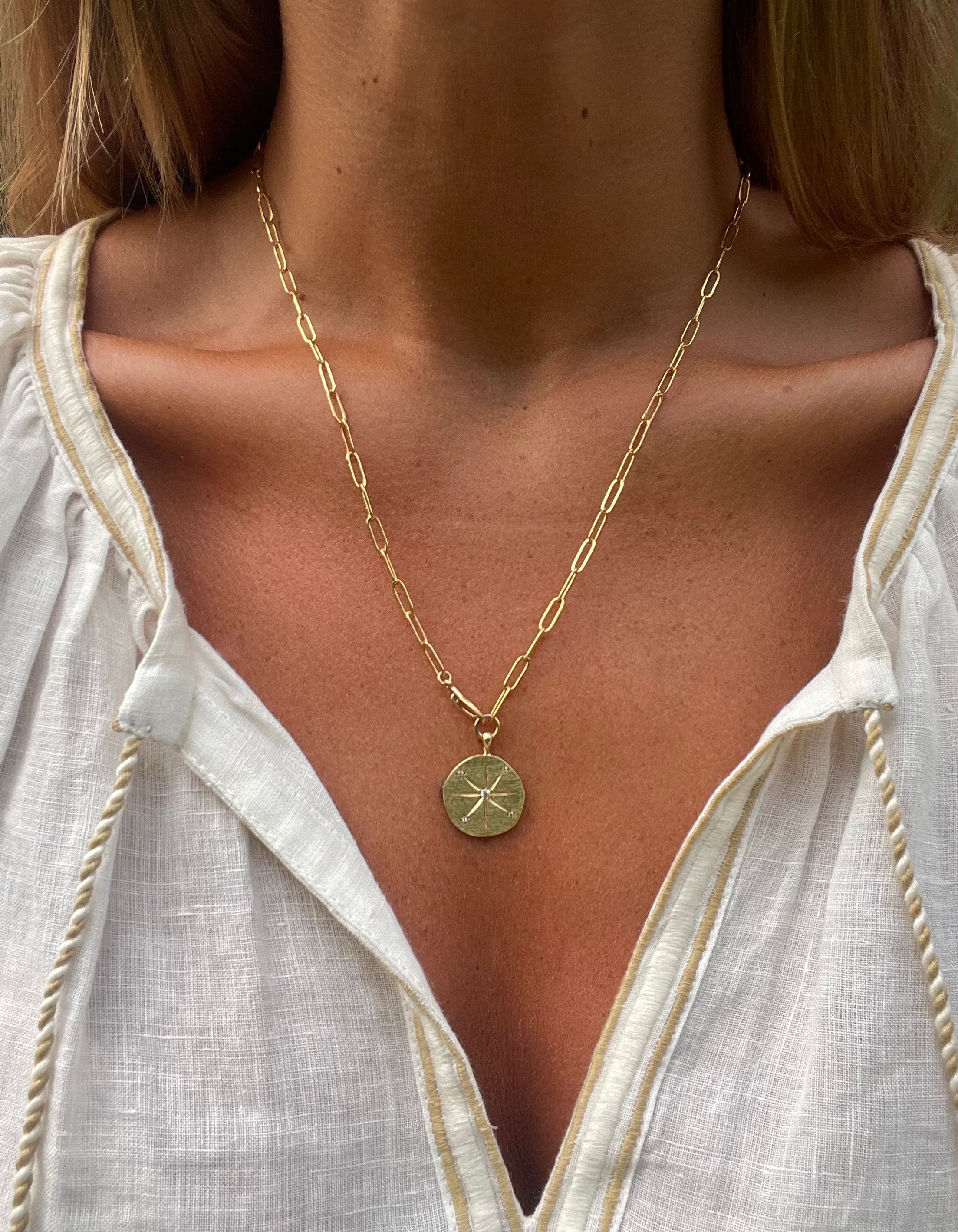 gold link chain necklace with sun medallion the falcon necklace neo medallion hanka in