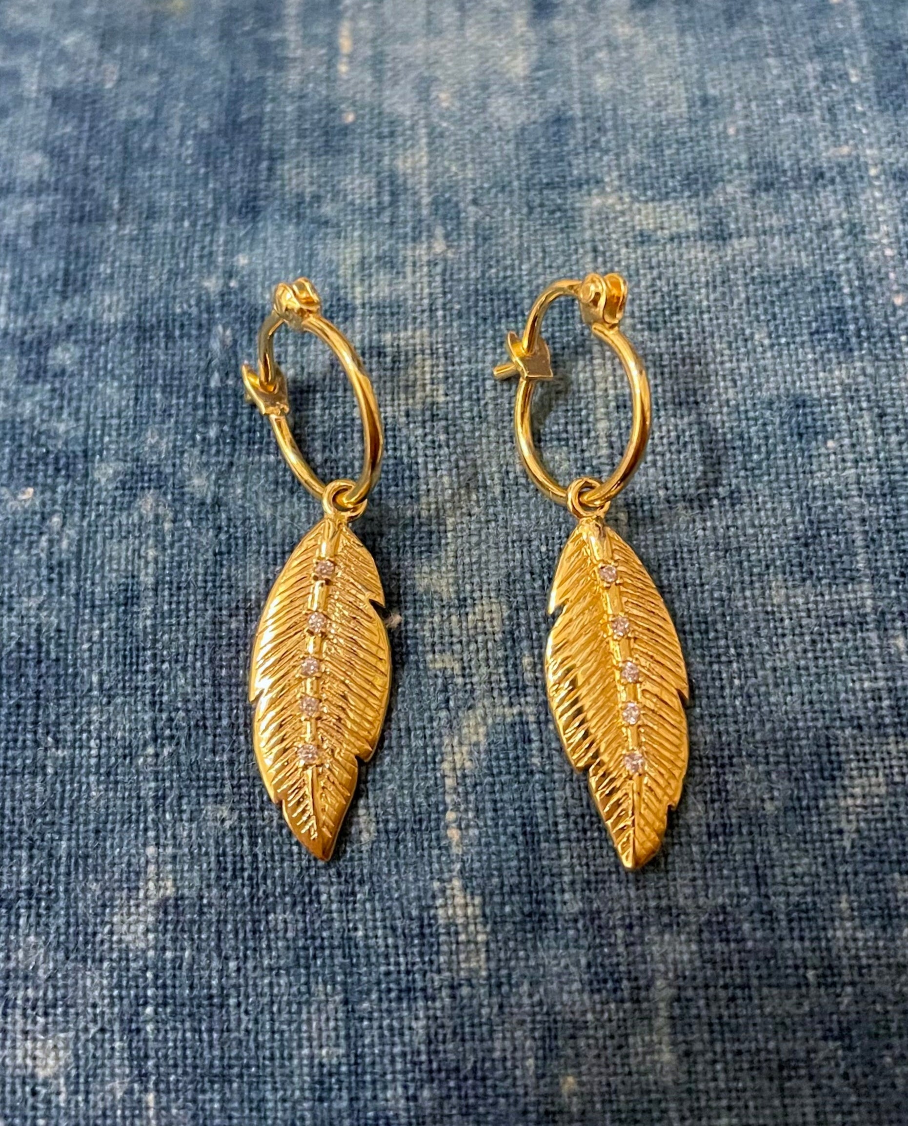 gold plated feather earrings louise hendricks saule earrings